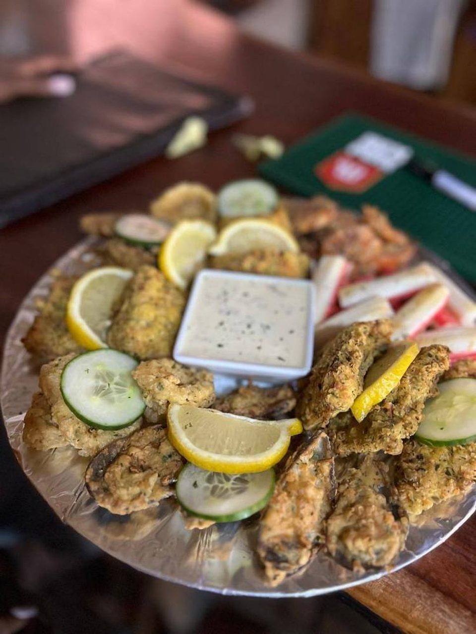 Fried seafood starter platter with lemon