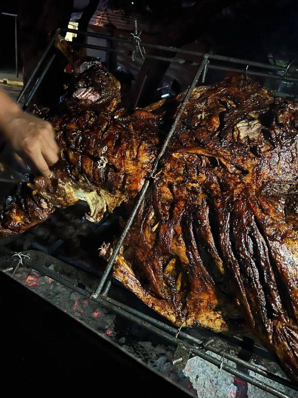 A whole spit-braai over the coals at an Omateko Lodge function